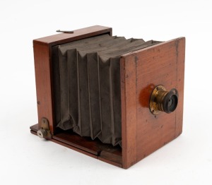 3¼ x 4¼" tailboard camera in mahogany with uninscribed brass lens.