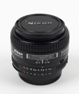 NIPPON KOGAKU: AF Nikkor 50mm f1.4D lens with front and rear caps.