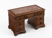 A&nbsp;vintage jewellery box in the form of a miniature twin pedestal desk with embossed tooled brown leather top, early to mid 20th century, ​​​​​​​19cm high, 31cm wide, 17cm deep