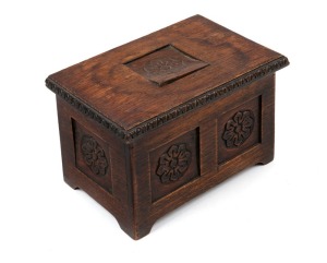 An antique oak miniature coffer with carved English rose panels, 19th/20th century, 11cm high, 16.5cm wide, 11cm deep