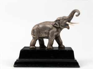 An antique Japanese silvered bronze elephant statue on ebonized timber base, Meiji period, 19th/20th century, 18.5cm high