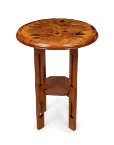 An antique New Zealand exhibition parquetry starburst tabletop, most likely Winks & Hall, Auckland, in the manner of Seuffert, mounted on later Australian blackwood Arts & Crafts base, the top 19th century, 77cm high, 59cm diameter