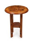 An antique New Zealand exhibition parquetry starburst tabletop, most likely Winks & Hall, Auckland, in the manner of Seuffert, mounted on later Australian blackwood Arts & Crafts base, the top 19th century, 77cm high, 59cm diameter