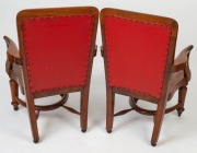 A pair of antique Australian blackwood elbow chairs with carved saddle seats and red leatherette upholstery, 19th century. Almost certainly a government department issue, possibly the Victorian Senate. ​​​​​​​94cm high, 62cm wide, 62cm deep - 2