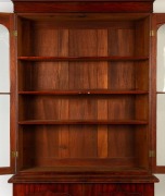 An impressive Colonial Australian cedar two door bookcase with inverted carved tulip centurion style pediment and shield shaped doors, Tasmanian origin, circa 1840, 250cm high, 135cm wide, 46cm deep - 2