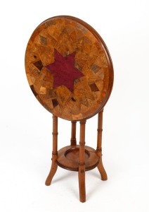 An antique New Zealand two tier occasional table with native timber parquetry starburst top, unfortunately damaged with later central replacement, 19th century, 72cm high, 59cm diameter