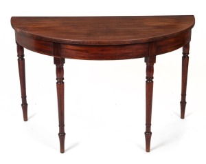 An antique English mahogany demi-lune side-table with ring turned legs, circa 1800. Note: This would originally have been the end of a larger dining table. 71cm high, 117cm wide, 58cm deep