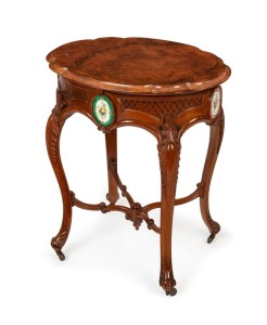 An antique French carved walnut sewing table with lift-top and French porcelain panels, interior fitted with plush velvet lift-out tray and compartments, 19th century, 74cm high, 63cm wide, 47cm deep