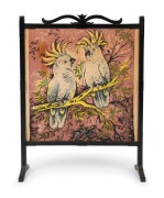 An Australian Arts & Crafts ebonised timber fire screen with Australian sulphur crested cockatoo printed fabric insert, circa 1920s-30s, 86cm high, 65cm wide, 23cm deep overall