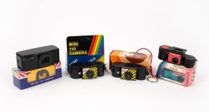 VARIOUS MANUFACTURERS: Six c. 1980s novelty subminiature plastic cameras, three of which in maker's box. (6 cameras)