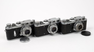 KRASNOGORSK MECHANICAL WORKS: Three c. 1950s rangefinder cameras - one Zorki 1b, one Zorki 1e with lens cap, and one Zorki 2 with lens cap. (3 cameras)