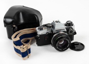 OLYMPUS: OM-10 SLR camera, c. 1979, with Zuiko Auto-S 50mm f1.8 lens, lens cap, neck strap, and leather case.