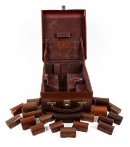 BOLEX-PAILLARD: Accumulation of twenty Kern-Paillard leather lens pouches in Bolex-Paillard camera case. (21 items)