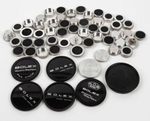 BOLEX-PAILLARD: Accumulation of fifty-eight rear lens caps, body caps, and front lens caps. (58 items)