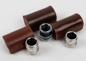 BOLEX-PAILLARD: Three lenses, each in leather case with rear cap - one Som Berthiot Lytar 12.5mm f1.8, one Som Berthiot Lytar 13mm f1.9, and one Yvar 13mm f1.8. (3 items)