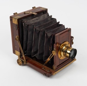 3⅛ x 4⅛" plate field camera with brass lens with f8/11/18/22/32/44 aperture markings.