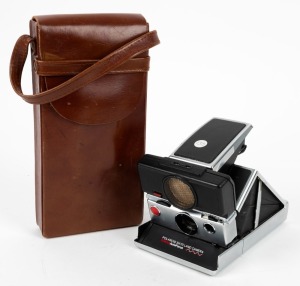 POLAROID: SX-70 Sonar AF folding instant film camera, c. 1978, with matching leather case.