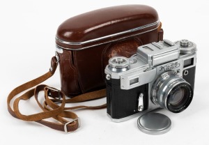 KIEV ARSENAL: Kiev 4 rangefinder camera, c. 1957, with Jupiter-8M lens, front lens cap, and matching leather case with 'Kiev' imprint.