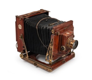 THORNTON-PICKARD: 'Royal Ruby' 4¾ x 6½" plate triple extension field camera, c. 1904, with Beck Symmetrical lens, Thornton-Pickard roller-blind shutter, and Watson Bowden 'The Antinuous' shutter release cable.