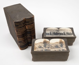 KEYSTONE VIEW COMPANY: Complete set of one hundred 'World War through the Stereoscope Volumes I & II' stereo cards in maker's cloth-lined box, c. 1918. (100 cards)