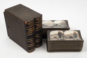 KEYSTONE VIEW COMPANY: Complete set of one hundred 'World War through the Stereoscope Volume I & II' stereo cards in maker's cloth-lined box, c. 1918. (100 cards)