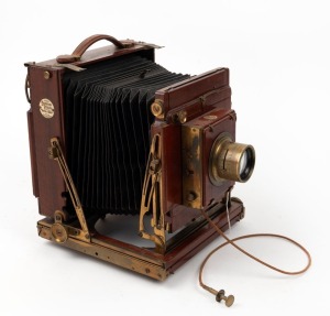 THORNTON-PICKARD: 'Royal Ruby' 4¾ x 6½" plate triple extension field camera, c. 1904, with Ross London Homocentric 7" f5.6 lens [#63019], lens cap, Thornton-Pickard roller-blind shutter, and Watson Bowden 'The Antinuous' shutter release cable.