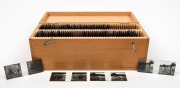 ZEISS IKON: Group of eighty-six 108 x 45mm stereo glass slides depicting a European family's home, holidaymaking in the countryside, and a trip to the canals of Venice. Neatly organised&nbsp;into wooden box with metal handle with 'Zeiss Ikon' logo.