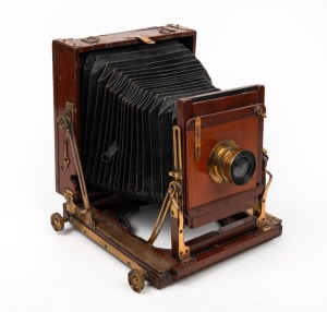 4¾ x 6½" plate triple-extension field camera, with brass lens with f8/11/16/22/32/44/64 aperture markings.