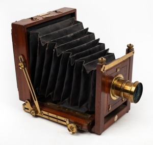 4¾ x 6½" plate field camera with brass lens with f8/11/16/22/32/44/64 aperture markings, and 'W. A. C. Smith Optician & Camera Maker Glasgow' retailer's inlay.