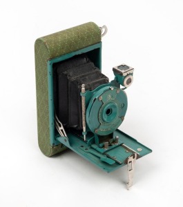 KODAK: Petite vertical-folding camera, c. 1929, in teal.