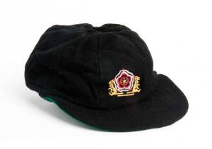 BEN HOLLIOAKE'S ENGLISH SCHOOLS CRICKET ASSOCIATION CAP, black with embroidered logo on front, named inside "B.Hollioake". G/VG condition.