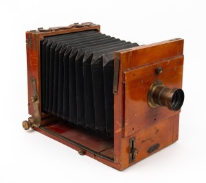 5 x 7" plate tailboard camera with lens with f8/11/16/22/32/44/64 aperture markings and 'Wira Spezialhaus für Kriminalistik Berlin' retailer's plate.