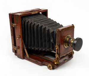 LANCASTER: '1898 Instantograph' 6½ x 4¾" plate field camera, with lens with f8/11/16/22/32/44/64 aperture markings, lens cap, unusual rear hinge mechanism, and 'Nadkarni & Co. Bombay' retailer's inlay.