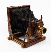 HOUGHTON: 'Triple Victo'&nbsp;4&frac34; x 6&frac12;"&nbsp;triple extension field camera, c. 1900s, with lens with f8/11/16/22/32/44/64 aperture markings and Thornton-Pickard roller-blind shutter.