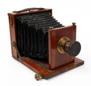 4¾ x 6½" plate field camera with lens with f8/11/16/22/32/44/64 aperture markings and lens cap.