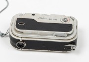 FEINWERKTECHNICK: Mec-16 SB subminiature camera [#5600295], c. 1960, with Heligon 22mm f2 lens and wrist chain. - 3