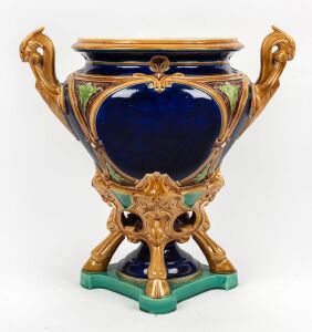 An antique English majolica jardiniere with griffin head handles, 19th century, 45cm high