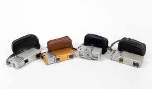 MINOLTA: Four c. 1960 Model II Minolta 16 subminiature cameras, all with leather pouches - one in gold, one in chrome, one in chrome with yellow lens filter, and one in chrome with tripod mount and accessory shoe. (4 cameras)