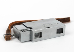 MINOLTA: Konan-16 Automat subminiature camera [#32064], c. 1950, in chrome with Rokkor 25mm f3.5 lens and wrist strap.