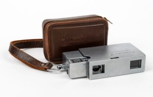 MINOLTA: Konan-16 Automat subminiature camera [#29744], c. 1950, in chrome with Rokkor 25mm f3.5 lens, maker's leather zip-case, and wrist strap.