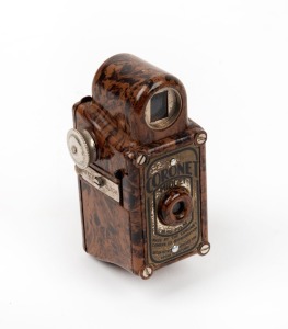 CORONET: Midget subminiature Bakelite camera, c. 1935, in brown.