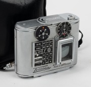 CONCAVA: Tessina&nbsp;Automatic 35 subminiature camera [#363973], c. 1960s, in chrome with Tessinon&nbsp;25mm f2.8 lens, together with black maker's zip-case and wrist strap. - 2