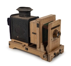 CHARTEN CAMERA WORKS: Japanese-made magic lantern, c. 1930s, with 5" f4 lens, leather bellows, and slide holder with glass plate.