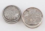 Two Georgian sterling silver patch boxes with engraved decoration, the larger 4.5cm diameter