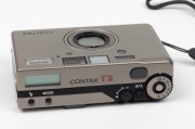 YASHICA: Titanium-body Contax T3 compact camera [#065301], c. 2001, with Carl Zeiss Sonnar T 35mm f2.8 lens. Offered in maker's box with leather case, wrist strap, and printed materials. - 3