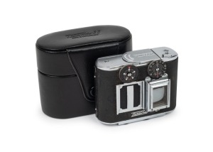 CONCAVA: Black-body Tessina 35 subminiature camera [#166853], c. 1970s, with Tessinon 25mm f2.8 lens, together with matching black leather case.