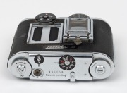 CONCAVA: Black-body Tessina&nbsp;35 subminiature camera [#166853], c. 1970s, with Tessinon 25mm f2.8 lens, together with matching black leather case. - 3