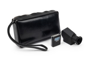 CONCAVA: Two rare black c. 1970s Tessina 35 accessories in black leather case - one Pentaprism Viewfinder attachment together with one DIN ASA Light Meter attachment. (2 items)