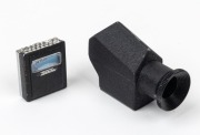 CONCAVA: Two rare black c. 1970s&nbsp;Tessina&nbsp;35 accessories in black leather case - one Pentaprism Viewfinder attachment together with one DIN ASA Light Meter attachment.&nbsp;(2 items) - 2