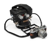LEITZ: 16905/AKGRSU underwater housing for Leica If/IIf/IIIf, produced&nbsp;c. 1954 in conjunction with famed Austrian diving technology pioneer Hans Haas and his Viennese firm 'Akustische und Kinoger&auml;te'. Attached to housing is a c. 1955 red-dial Leica If cam